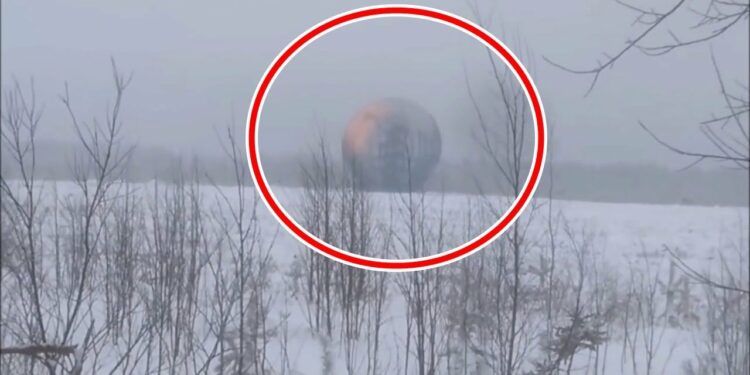 A giant sphere emitting glowing designs has been filmed in Russia—sparking claims of alien technology that could send hidden messages in plain sight.